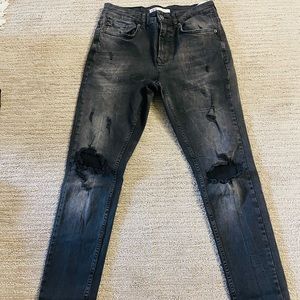 Zara black ripped jeans with neon band fold.